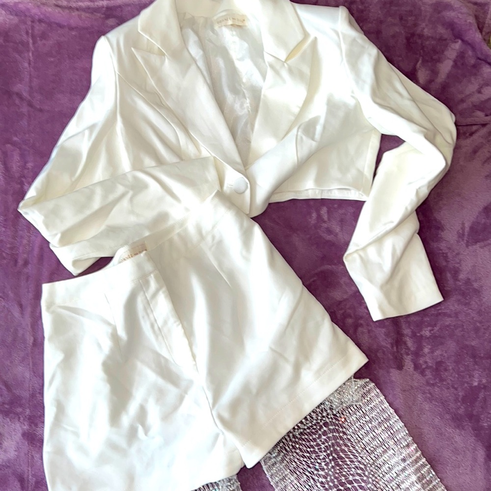 Two piece set. All white. Cropped jacket w/ matching high waisted studded pants.
